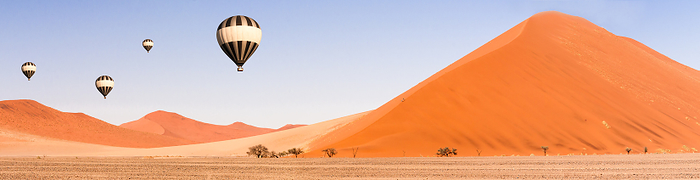 Dunes and Balloons in the Namib Desert to the horizon, Namibia, Africa. Dunes and Balloons in the Namib Desert to the horizon, Namibia, Africa., by Zoonar Uwe Bauch