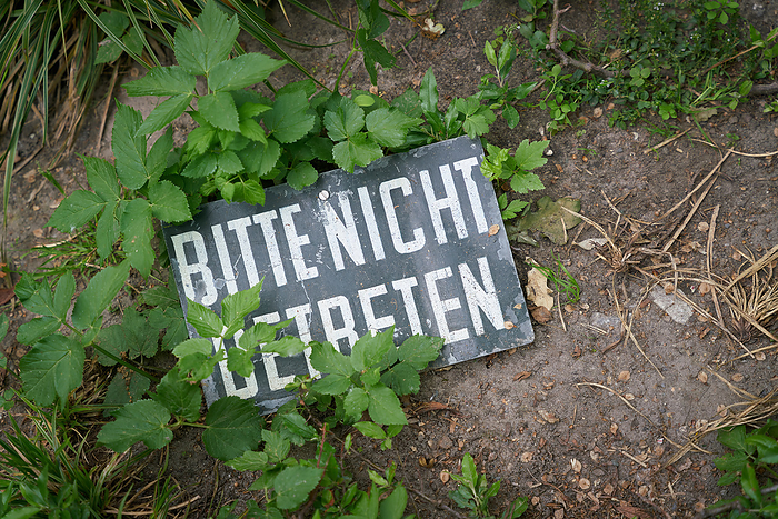 Prohibition sign on the ground of a green area. Translation on the sign: please do not enter Prohibition sign on the ground of a green area. Translation on the sign: please do not enter, by Zoonar Heiko Kueverl