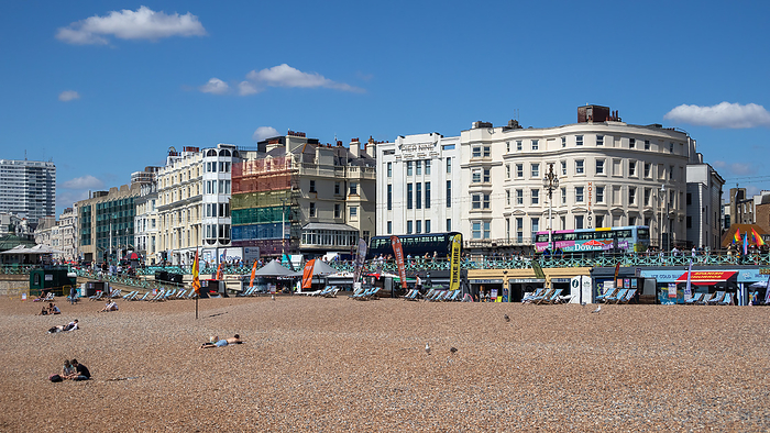 Brighton, East Sussex, UK   August 5 2022 : View of the beach in Brighton on August 5, 2022. Unidentified people Brighton, East Sussex, UK   August 5 2022 : View of the beach in Brighton on August 5, 2022. Unidentified people, by Zoonar Phil Bird