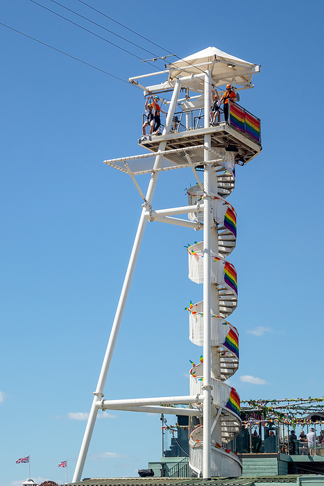 Brighton, East Sussex, UK   August 5, 2022 : View of the zip wire tower in Brighton on August 5, 2022. Unidentified people Brighton, East Sussex, UK   August 5, 2022 : View of the zip wire tower in Brighton on August 5, 2022. Unidentified people, by Zoonar Phil Bird