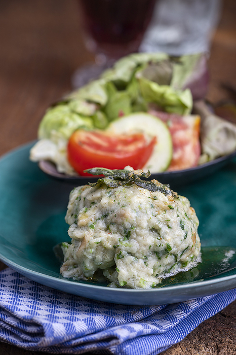 rustic spinach dumpling with salad rustic spinach dumpling with salad, by Zoonar Bernd Juergen