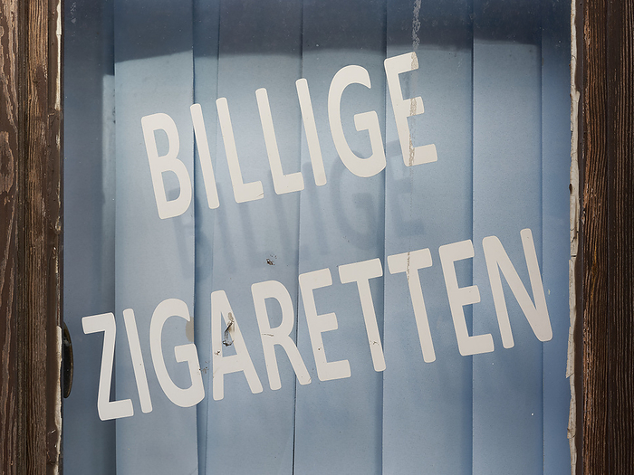 Shop window with the inscription cheap cigarettes in the Polish town of Swinoujscie Shop window with the inscription cheap cigarettes in the Polish town of Swinoujscie, by Zoonar HEIKO KUEVERL