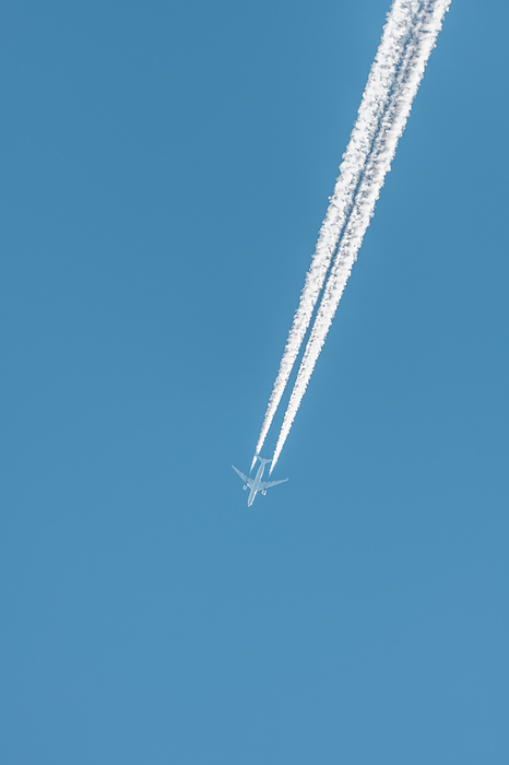 Airliners in flight in a blue sky in late summer. Airliners in flight in a blue sky in late summer., by Zoonar christian d 