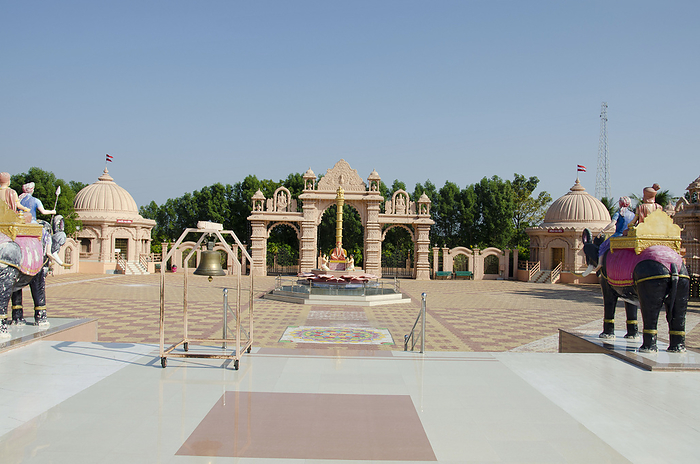 Shastri Maharaj Statue and carved gateways at Nilkanthdham, Swaminarayan temple complex, Poicha, Poicha, Gujarat, India Shastri Maharaj Statue and carved gateways at Nilkanthdham, Swaminarayan temple complex, Poicha, Poicha, Gujarat, India, by Zoonar RealityImages