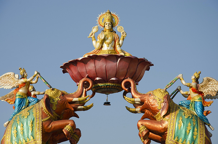 Gajalaxmi flanked by elephants at entrance gate of Nilkanthdham, Swaminarayan temple, Poicha, Gujarat, India Gajalaxmi flanked by elephants at entrance gate of Nilkanthdham, Swaminarayan temple, Poicha, Gujarat, India, by Zoonar RealityImages