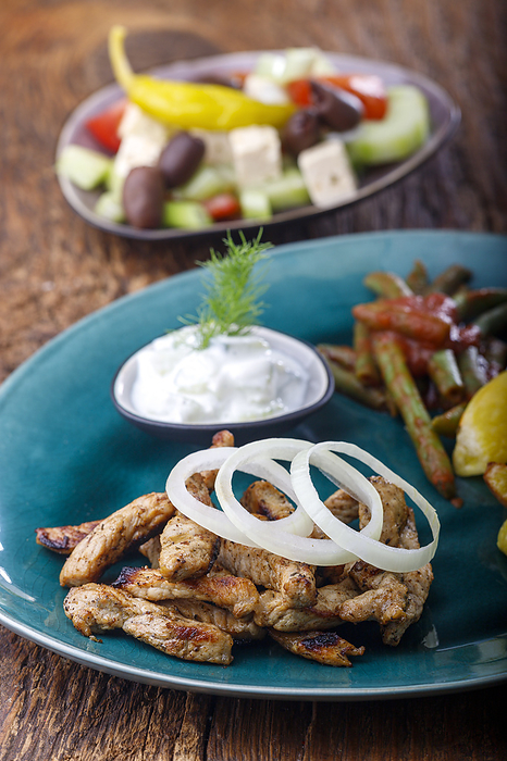 Greek gyros with fries on wood Greek gyros with fries on wood, by Zoonar Bernd Juergen
