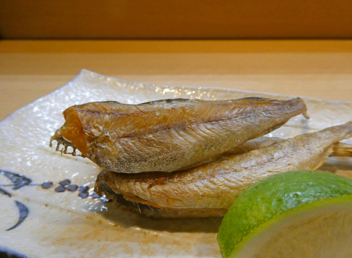 A photo of seared, dried fish under ice, a winter delicacy of Hokkaido.