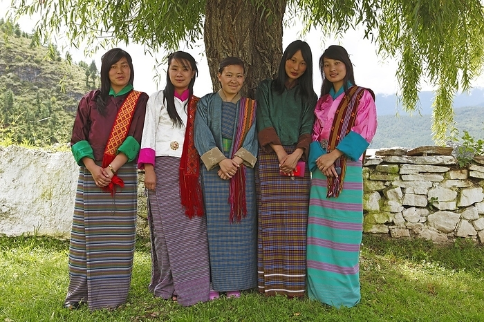 Bhutan Traditional Costume Young women wearing colorful Kira dresses, Paro district, Bhutan, Asia