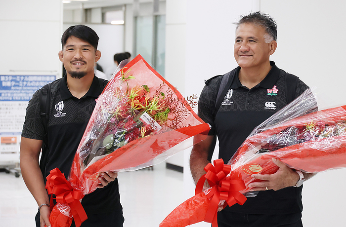 Japan s national rugby team returns from France after the Rugby World Cup October 11, 2023, Narita, Japan   Japan s rugby national team head coach Jamie Joseph  R  and captain Kazuki Himeno  L  receive flower bouquets from Japan Airlines  JAL  employees upon their arrival at the Narita international airport in Narita, suburban Tokyo on Wednesday, October 11, 2023. Japan s rugby national squad was not qualified to the final round of the Rugby World Cup in France.   photo by Yoshio Tsunoda AFLO 