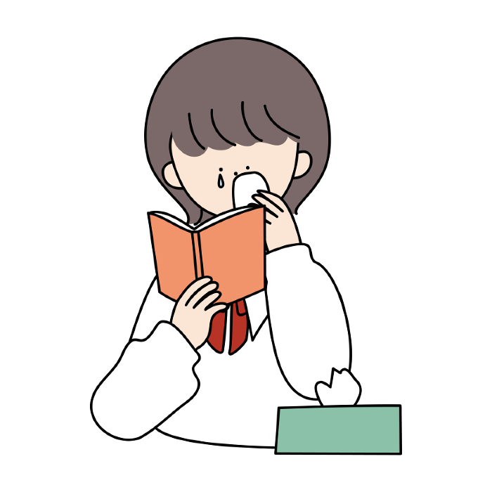 Girl crying over a book