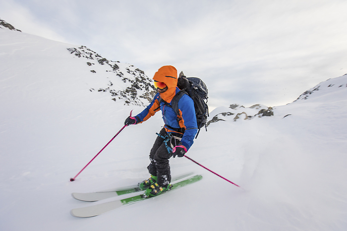 Side view of man moving fast on skis, by Cavan Images / Christopher Kimmel / Alpine Edge Photography