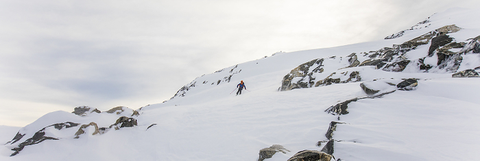 Skier in remote winter landscape, Coast Mountains, B.C., by Cavan Images / Christopher Kimmel / Alpine Edge Photography