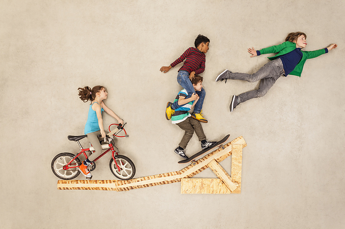 Kids with bike and skateboard on jump Kids with bike and skateboard on jump