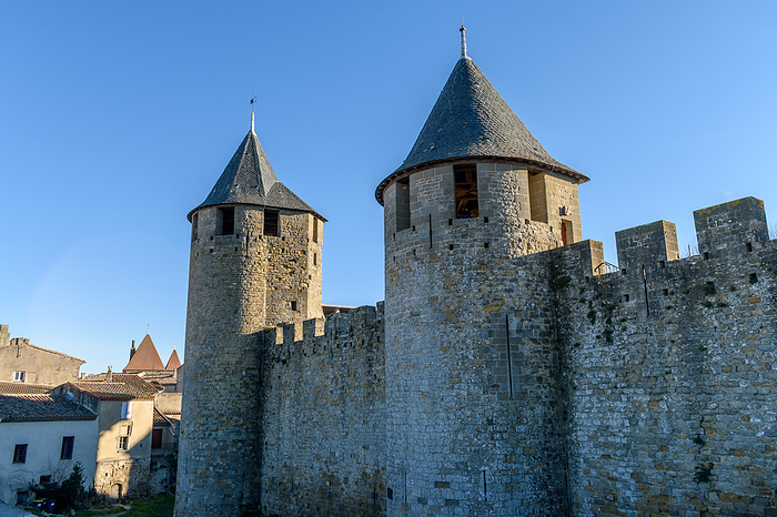 Carcassonne, France The Chateau Comtal, Count s Castle, is a medieval castle in the Cit of Carcassonne, tall towers and wall, and a bridge to a fortified gate. , Carcassonne, Aude, France