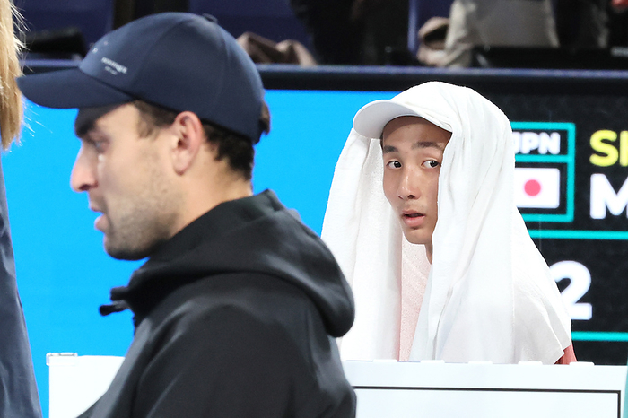 The semi final match of the Japan Open tennis championshipssecond October 21, 2023, Tokyo, Japan   Shintaro Mochizuki  R  of the Japan, covered with a towel looks at Aslan Karatsev  L  of Russia as rain started to fall during the semi final match of the Japan Open tennis championships at the Ariake Colosseum in Tokyo on saturiday, October 21, 2023.    photo by Yoshio Tsunoda AFLO  