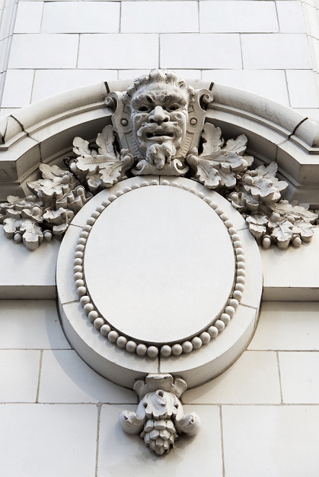 Sculpture Of A Face On The Exterior Wall Of The Coliseum Theatre; Seattle, Washington, United States Of America