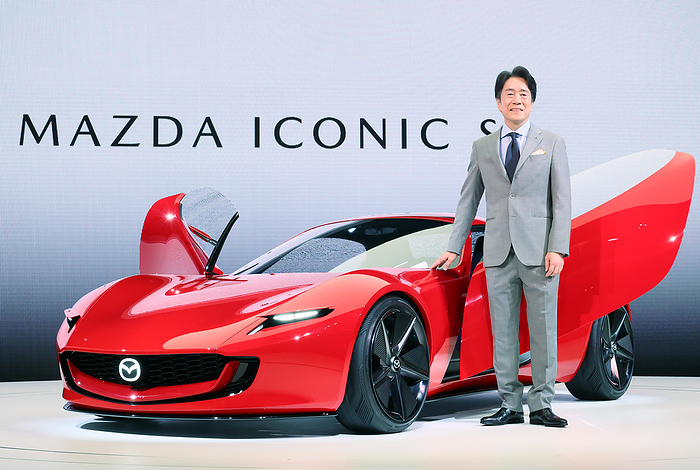 Concept vehicles are displayed at a press preview of the Japan Mobility Show  October 25, 2023, Tokyo, Japan   Japan s automaker Mazda Motor president Masahiro Moro displays the concept compact sports electric vehicle  Iconic SP which has two roter rotary EV system at a press preview at the Japan Mobility Show 2023 in Tokyo on Wednesday, October 25, 2023. The Japan Mobility Show 2023 will be held from October 28 through November 5.     photo by Yoshio Tsunoda AFLO 