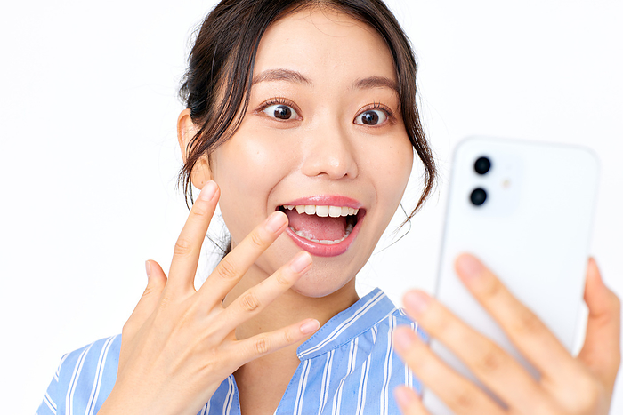 Japanese woman surprised to see a smartphone