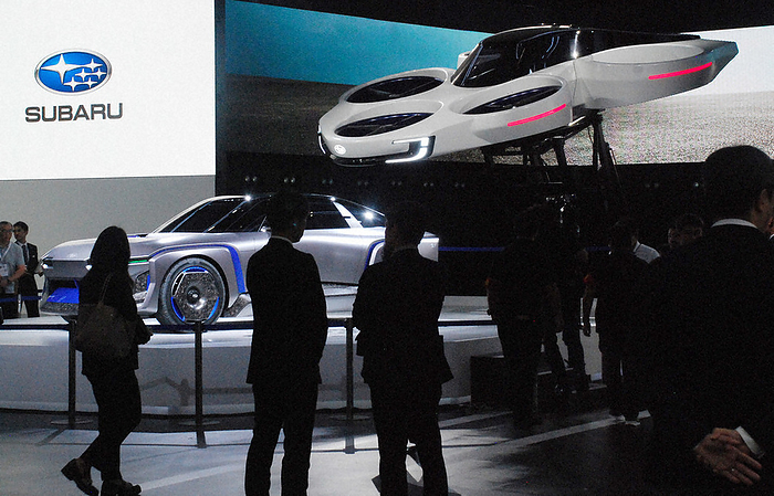 Japan Mobility Show 2023 Press Day A prototype of a flying car  top right  at the Subaru booth attracted visitors  attention at Tokyo Big Sight on October 25, 2023.