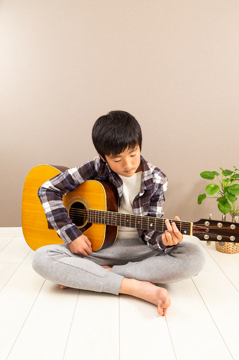Boy playing guitar