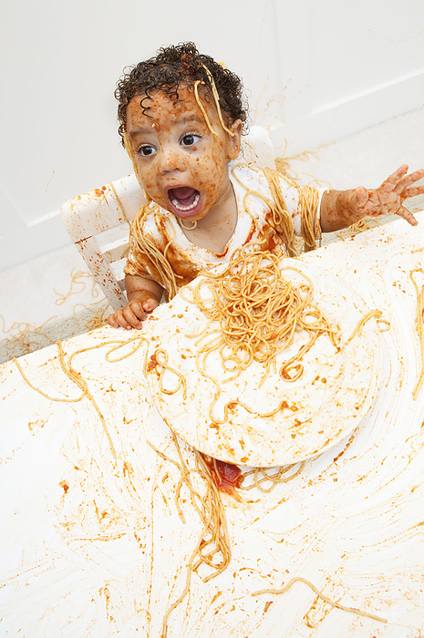 Boy eating Spaghetti with Hands, by Amy Whitt / Design Pics