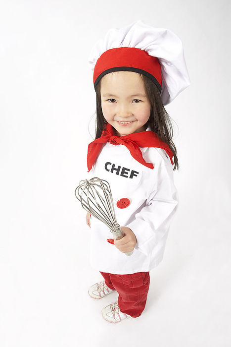 Little Girl Dressed Up as a Chef Holding a Whisk, by Edward Pond / Design Pics