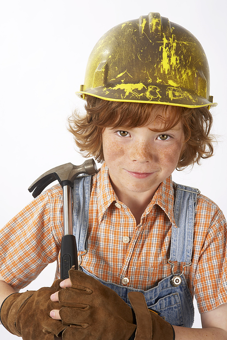 Little Boy Dressed Up as Construction Worker Holding a Hammer, by Edward Pond / Design Pics
