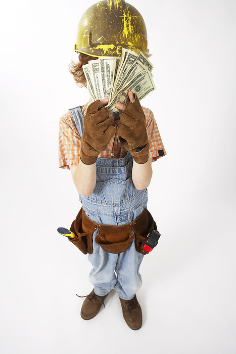 Little Boy Dressed Up as Construction Worker Holding Cash, by Edward Pond / Design Pics