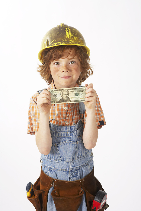 Boy Dressed Up as Construction Worker Holding Money, by Edward Pond / Design Pics