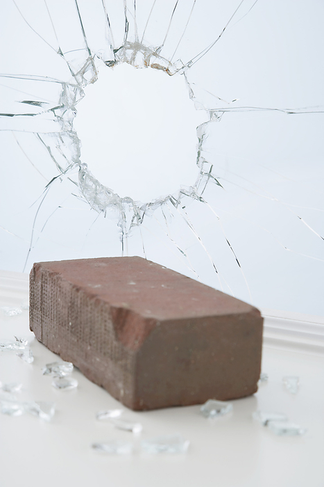 Brick and Broken Window, by photo division / Design Pics