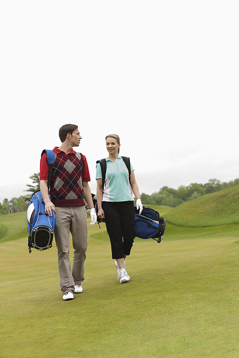Couple Walking on Golf Course, by Hiep Vu / Design Pics