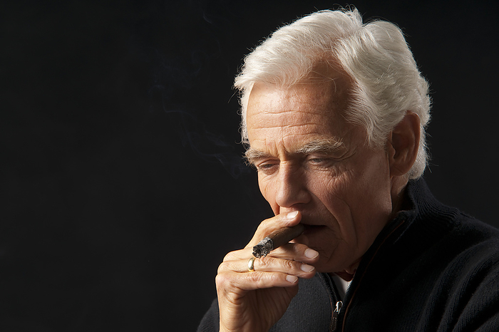 Man Smoking Cigar, by Jens Lüebkemann / Design Pics