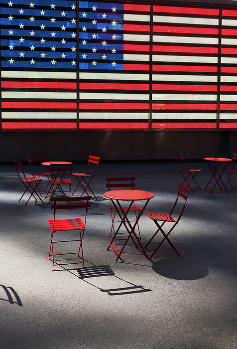 Electronic American Flag with empty tables and chairs, Times Square, New York City, New York, USA, by Jeremy Walker / Design Pics