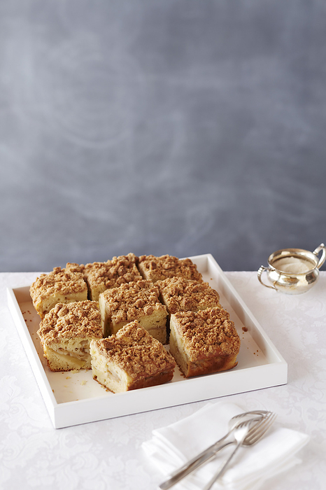 Crumble coffee cake on a white serving tray, by Jodi Pudge / Design Pics