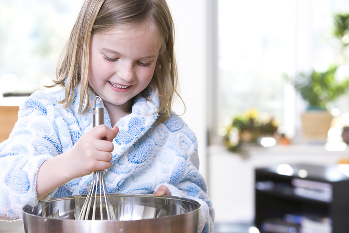 Little Girl Baking, by John Lee / Design Pics