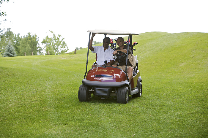 Men in Golf Cart, Burlington, Ontario, Canada, by Mark Leibowitz / Design Pics
