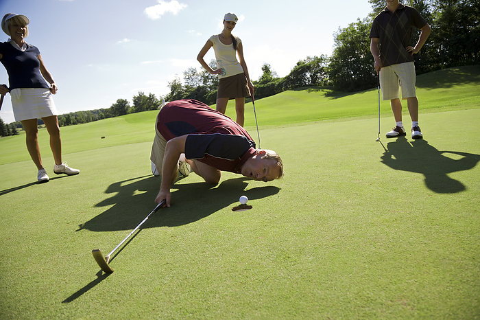 Family Playing Golf, Burlington, Ontario, Canada, by Mark Leibowitz / Design Pics