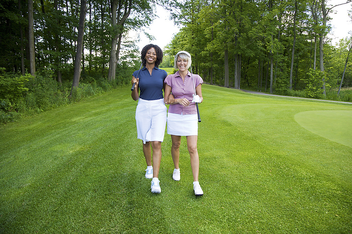 Women Walking on Golf Course, by Mark Leibowitz / Design Pics