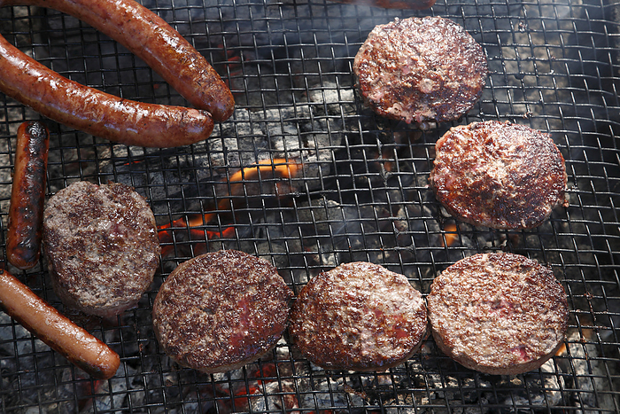 Close-up of Burgers and Hot Dogs on the Barbecue, Houston, Texas, USA, by Mark Peter Drolet / Design Pics
