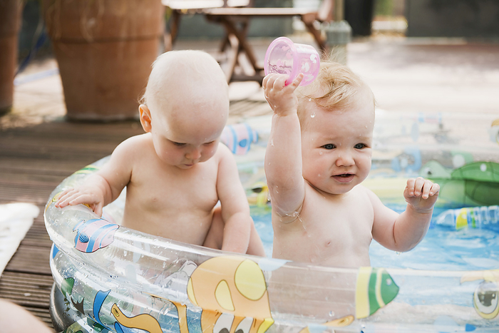 Baby Girls in Inflatable Pool, by I. Jonsson / Design Pics