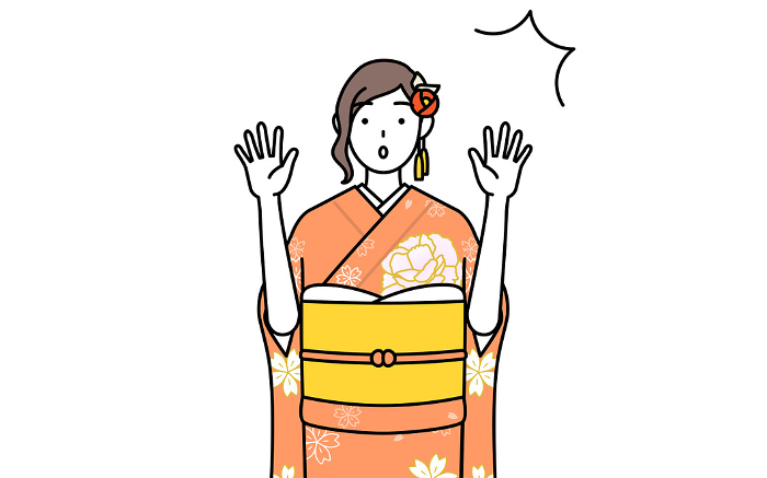 A woman in a furisode kimono raises her hand in surprise, at a New Year's hatsumode, a coming-of-age ceremony, a graduation ceremony, a wedding, etc.