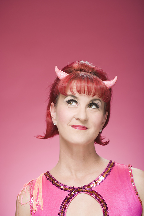 Portrait of Woman Wearing Devil Horns, by Mitch Tobias / Design Pics