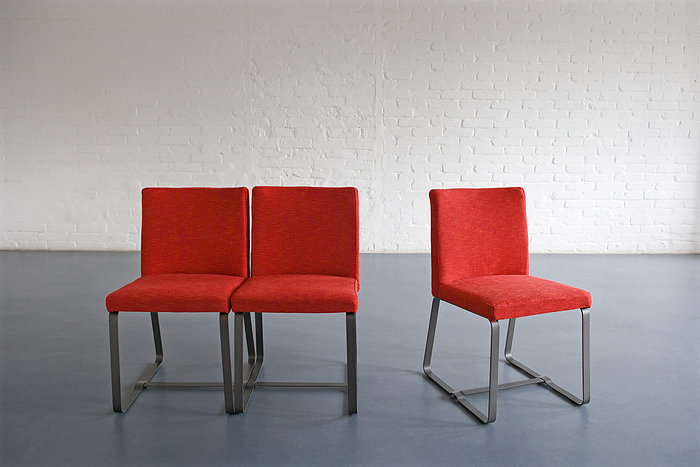 Red Chairs against Wall, by Norbert Schäfer / Design Pics
