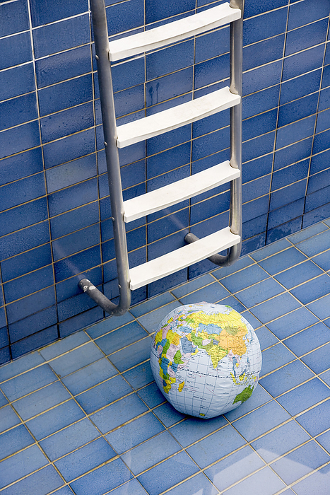Globe at Bottom of Pool, by Norbert Schäfer / Design Pics