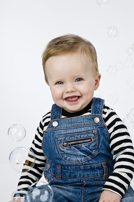 Portrait of Baby Boy Surrounded by Bubbles, by Norbert Schäfer / Design Pics
