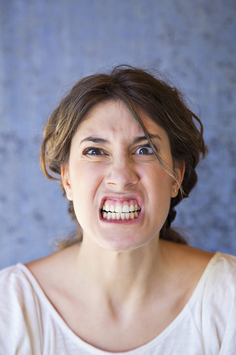 Angry Woman in Studio, by Norbert Schäfer / Design Pics
