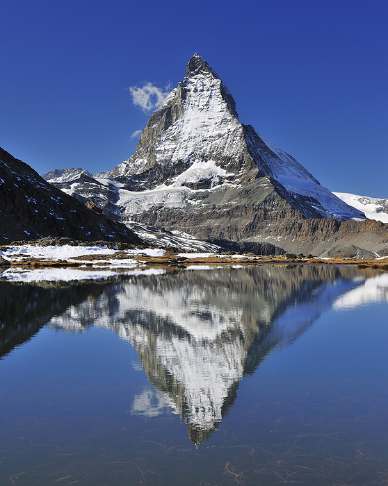 Matterhorn reflected in Lake Riffelsee, Zermatt, Alps, Valais, Switzerland, by Raimund Linke / Design Pics