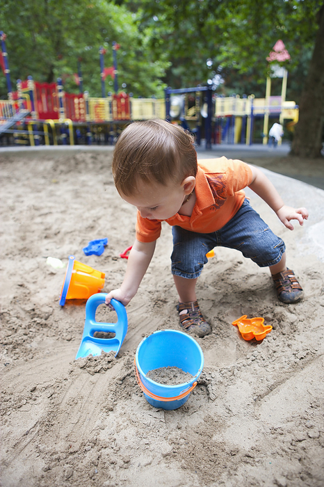Boy Playing in Sandbox, Washington Park Playground, Portland, Oregon, USA, by Ty Milford / Design Pics