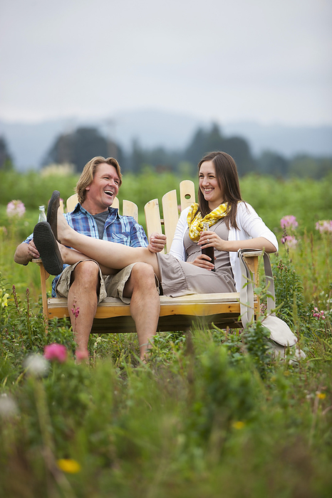 Couple on Bench in Field, Portland, Oregon, USA, by Ty Milford / Design Pics