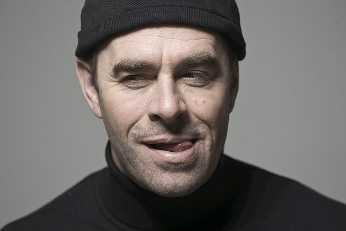 Portrait of Man in Black Cap, by Uwe Umstätter / Design Pics